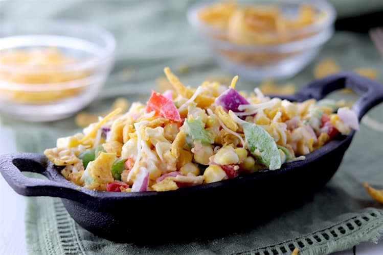 Light Potluck Corn Salad with Crushed Fritos in a Cast Iron Dish