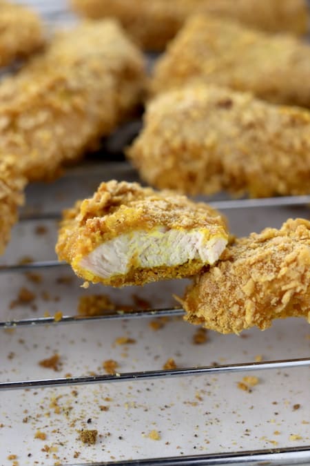 Baked turmeric chicken tenders on a cooling rack 2