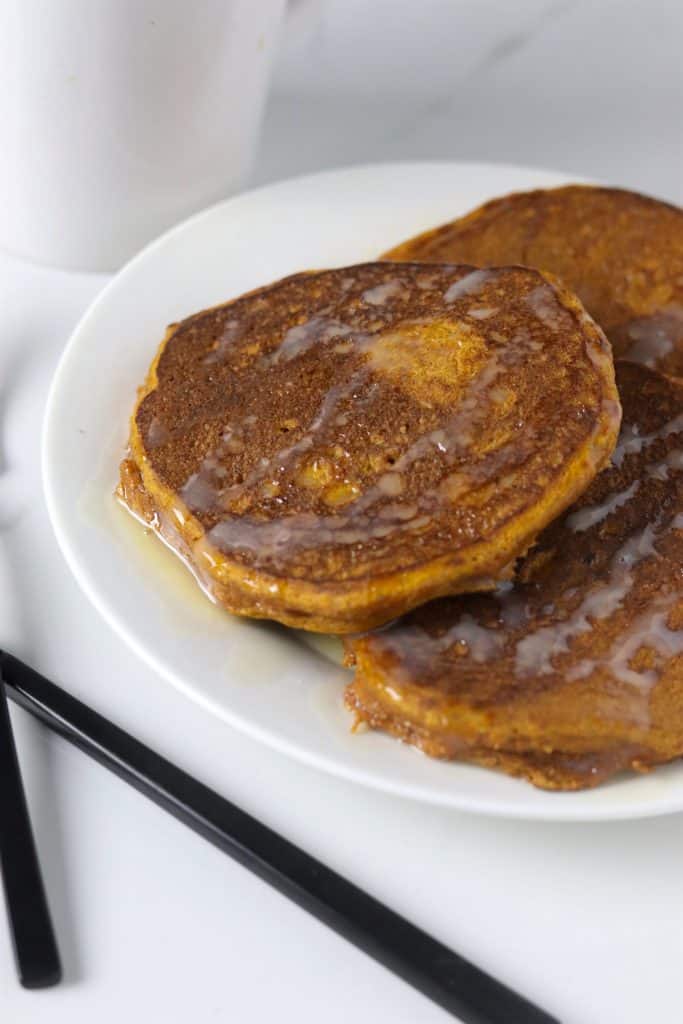 Whole wheat pumpkin pancakes with white chocolate sauce