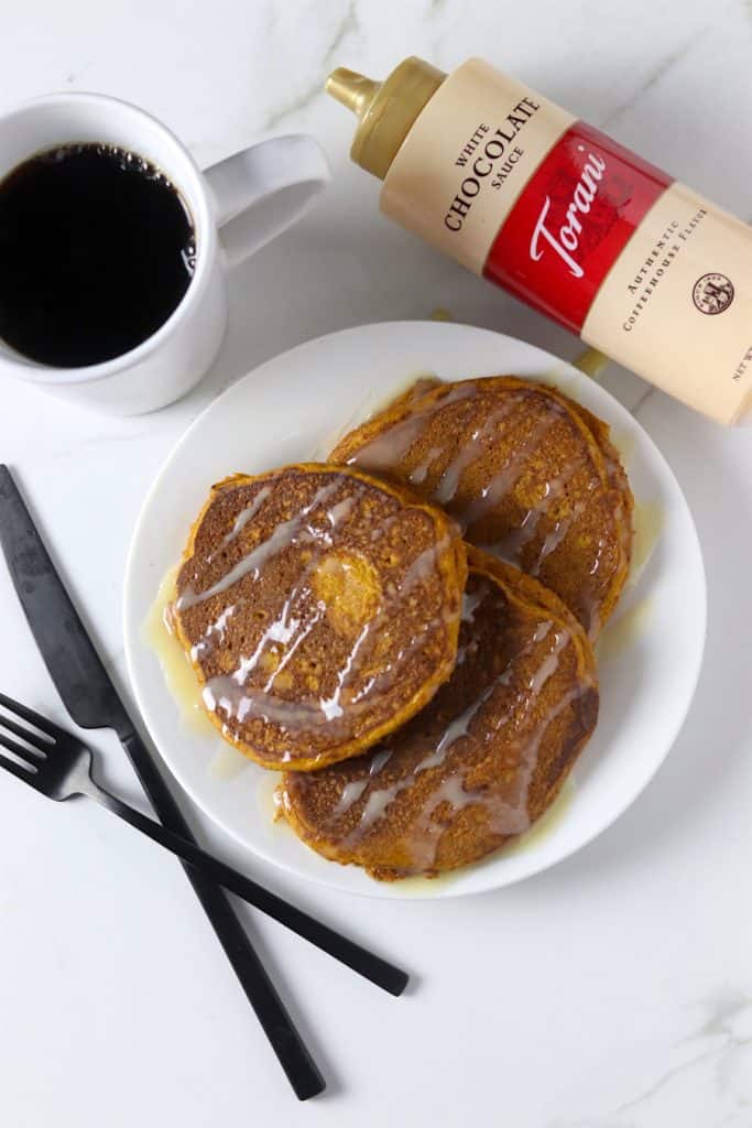 Whole wheat pumpkin pancakes with white chocolate sauce