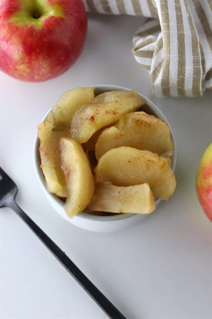 Warm crockpot baked apples in a bowl