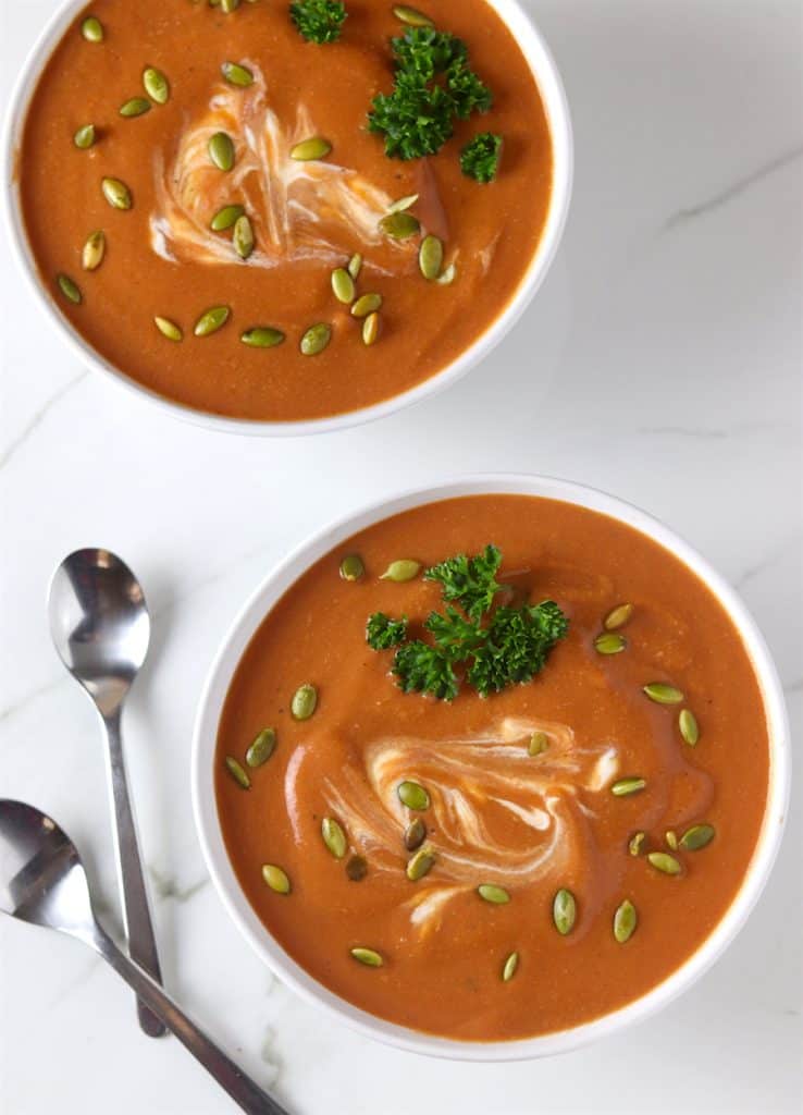 two bowls of creamy butternut squash & tomato soup