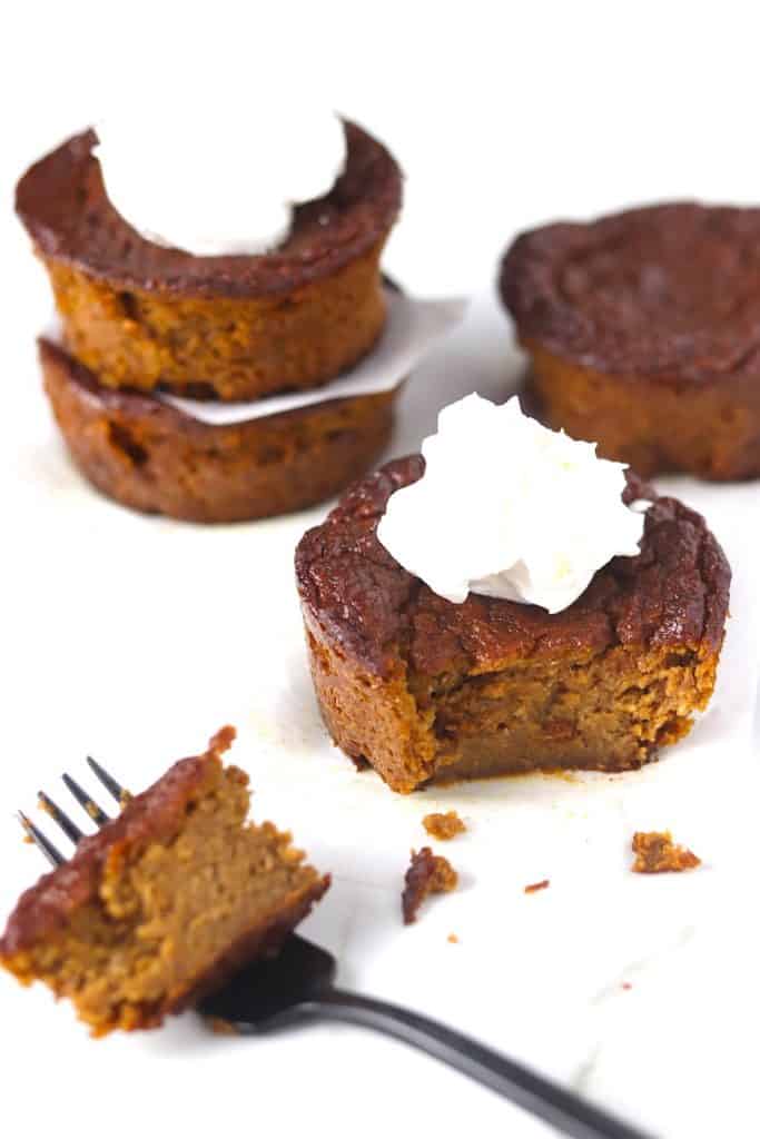 gluten & dairy free mini pumpkin pies eaten with a fork