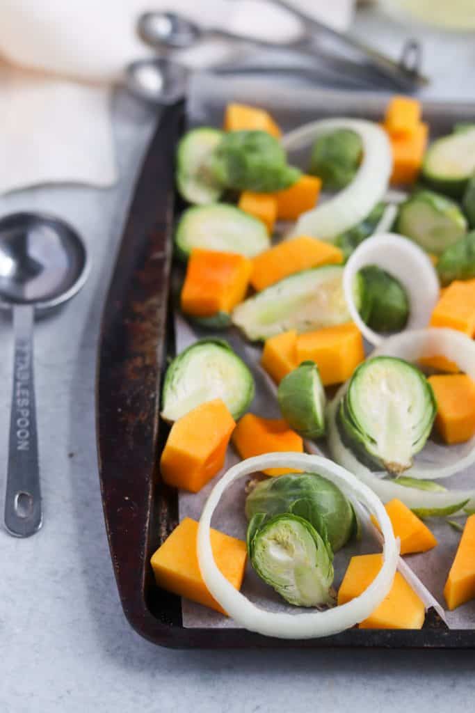 This sheet pan butternut, brussels, and sausage dinner will be your weeknight life saver! Quick, easy and next to no dishes!