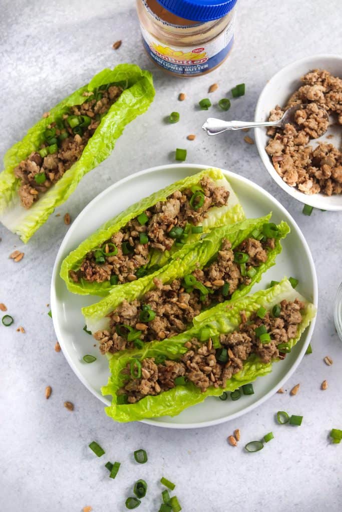 These easy, healthy & freezer friendly chicken lettuce wraps will become a weeknight staple! The secret ingredient (SunButter!) gives them AMAZING flavor you won't be able to get enough of! #easyrecipes #dinnerrecipes #freezerfriendly #weeknightmeal