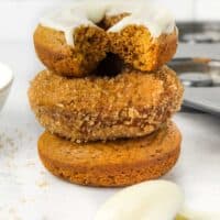 stacked baked pumpkin donuts.