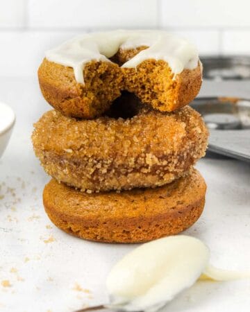 stacked baked pumpkin donuts.