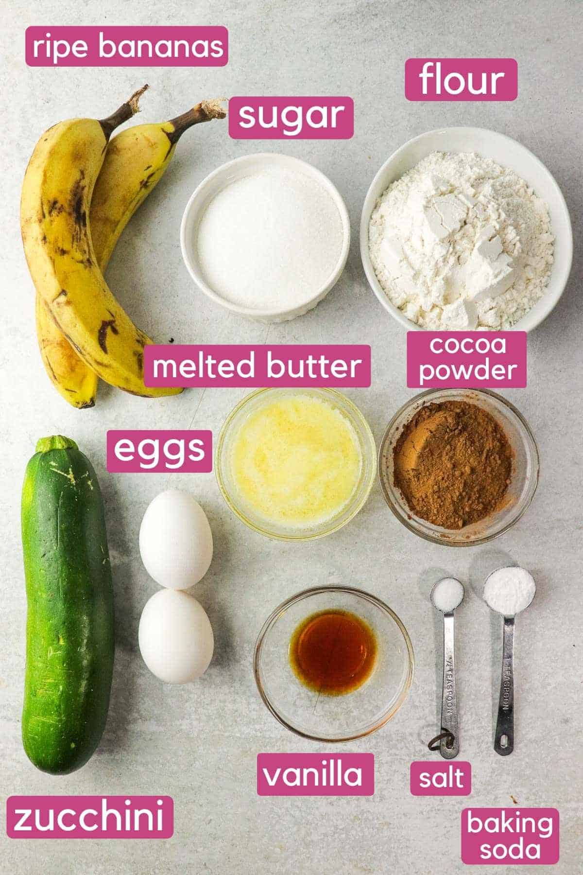 The ingredients needed to make zucchini banana chocolate chip muffins, including zucchini and ripe bananas.