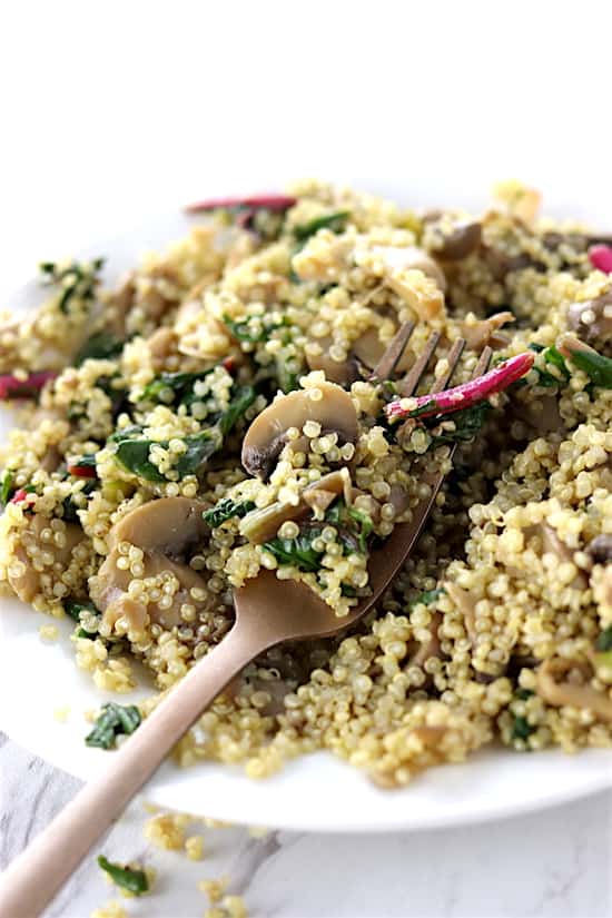 Swiss chard and mushroom quinoa with gold fork