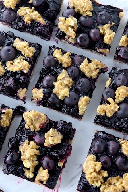 blueberry crumble bars cut on a counter