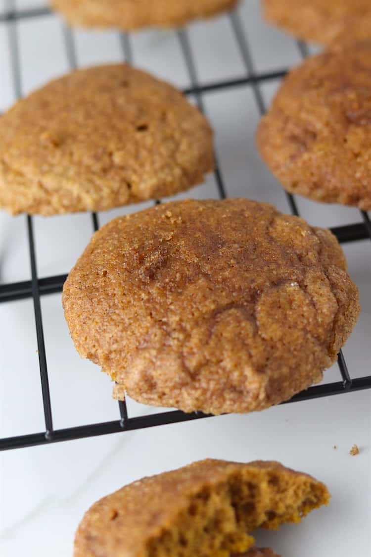 soft baked pumpkin snickerdoodles on a cooling rack