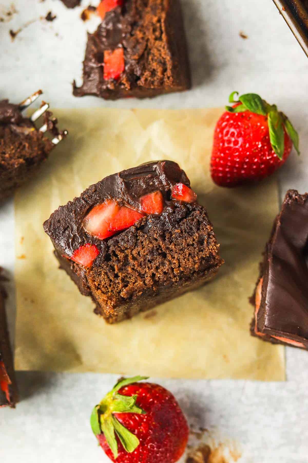 chocolate covered strawberry brownie on it's side.