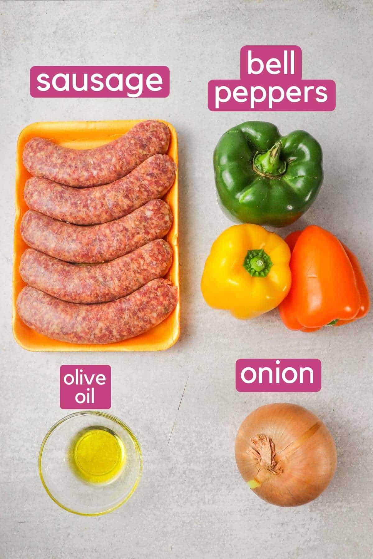 The ingredients needed to make air fryer sausage and peppers: sausages, bell peppers, olive oil, onion