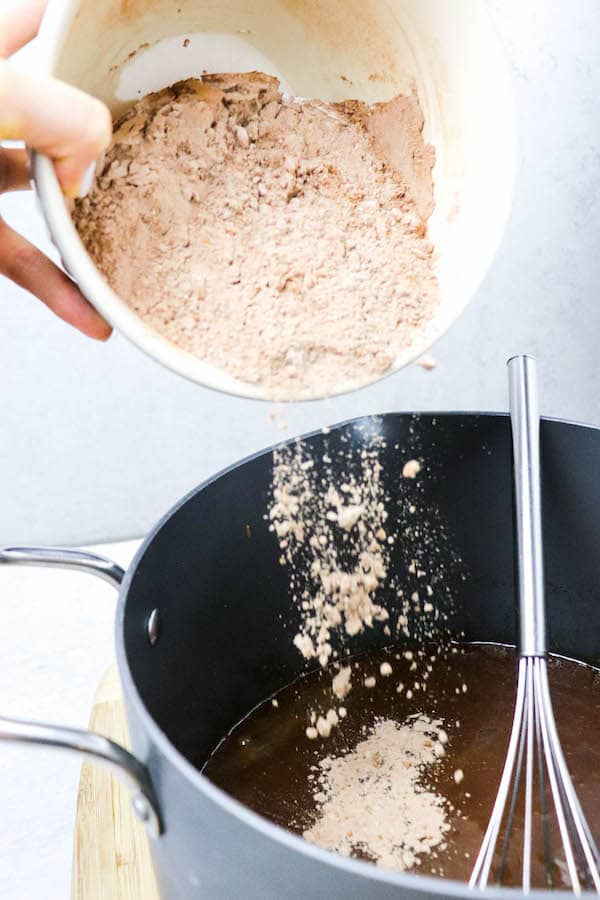 dry ingredients being added to bakery brownies