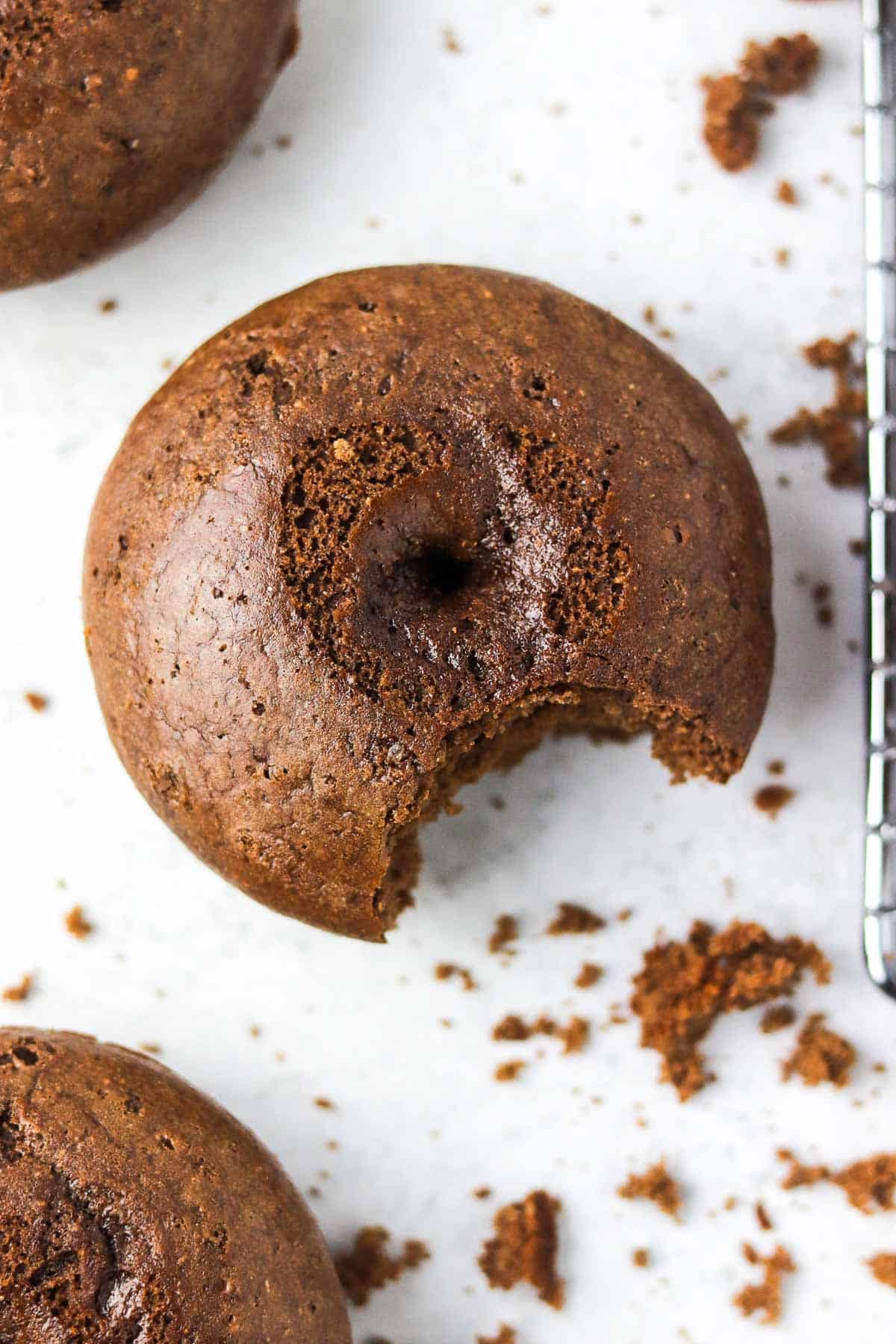 chocolate protein donut with a bite out.