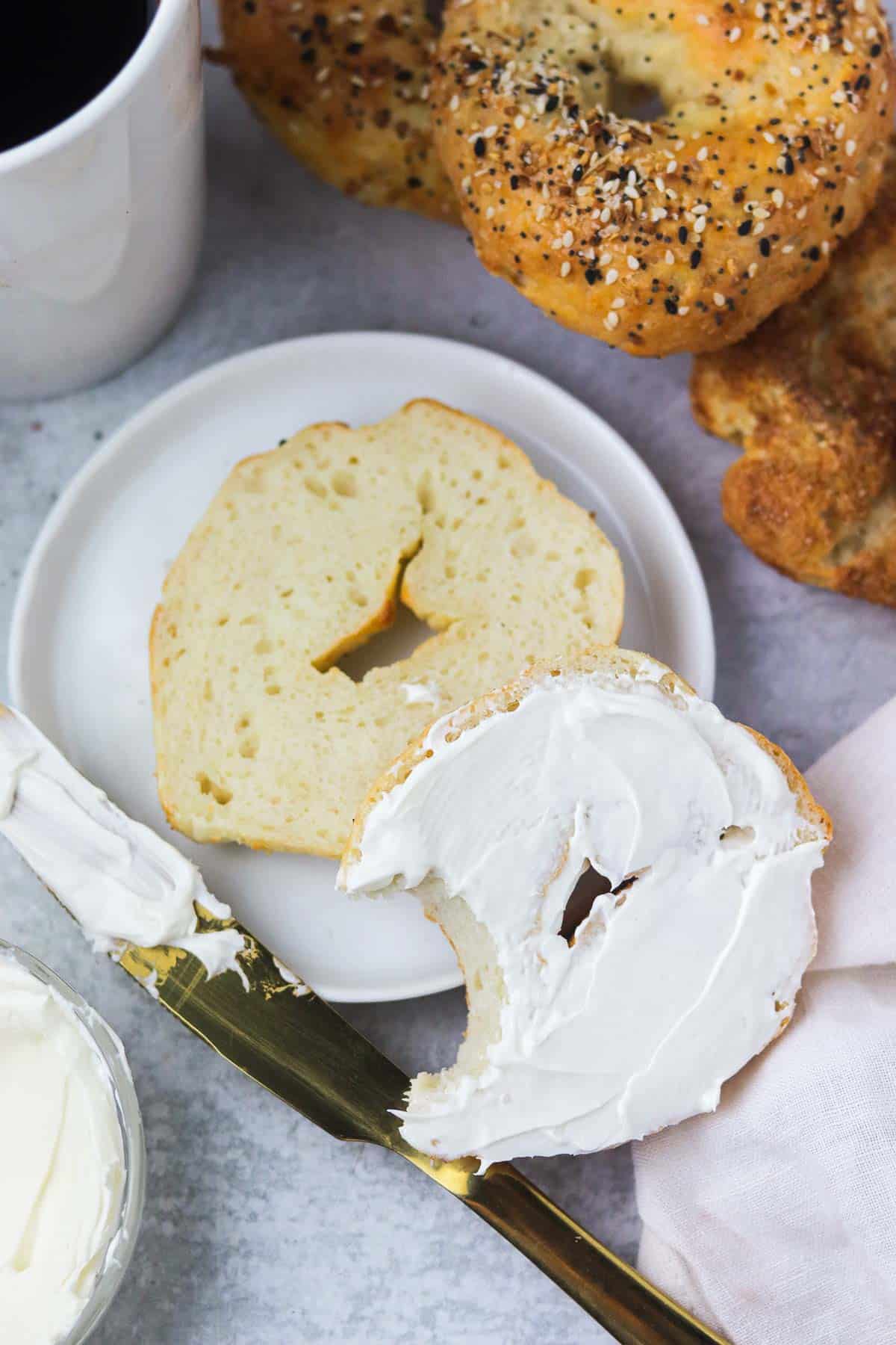 3 ingredient bagel cut in half with cream cheese.