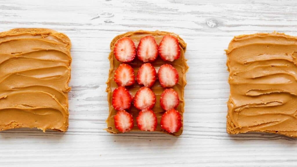 peanut butter with palm oil or peanut butter without palm oil on toast with strawberries