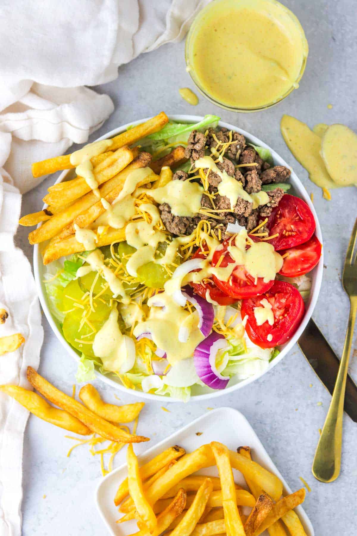 Big mac in a bowl with big mac sauce.