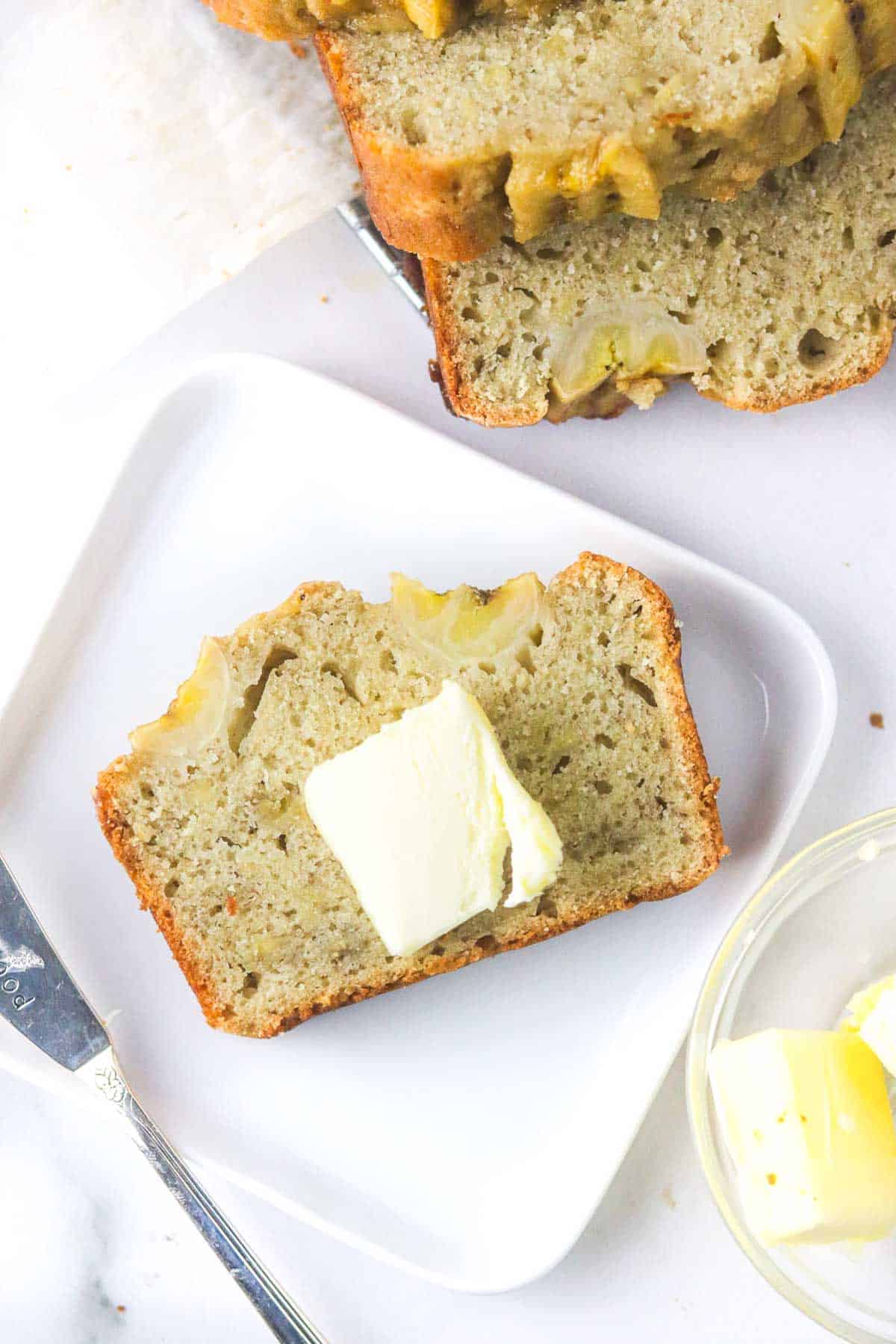 butter on a slice of dairy free banana bread