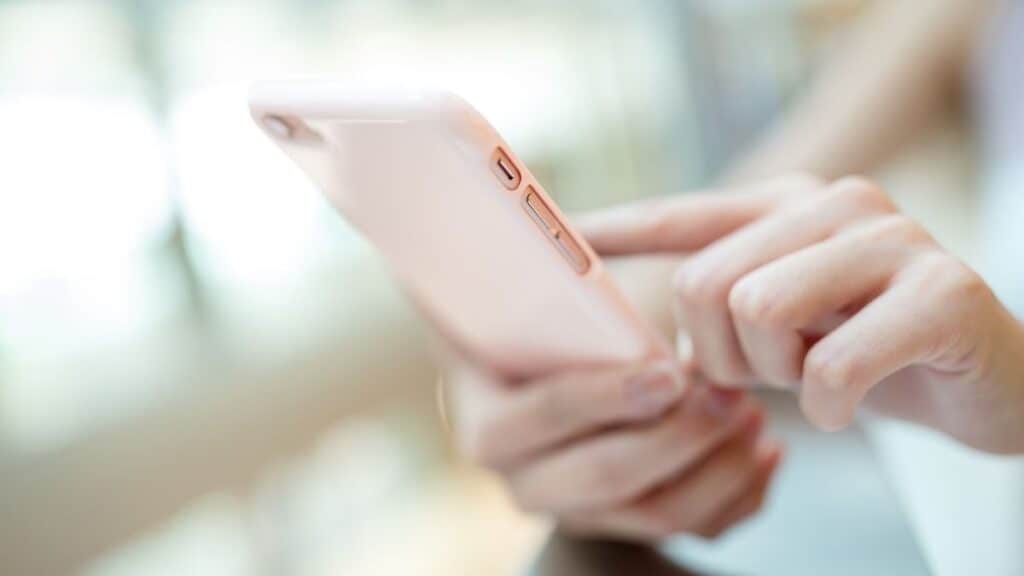 holding pink phone