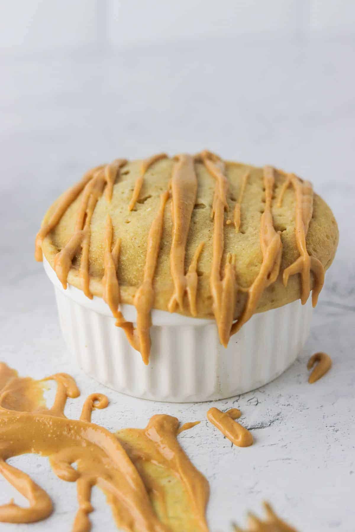 peanut butter protein mug cake in white ramekin