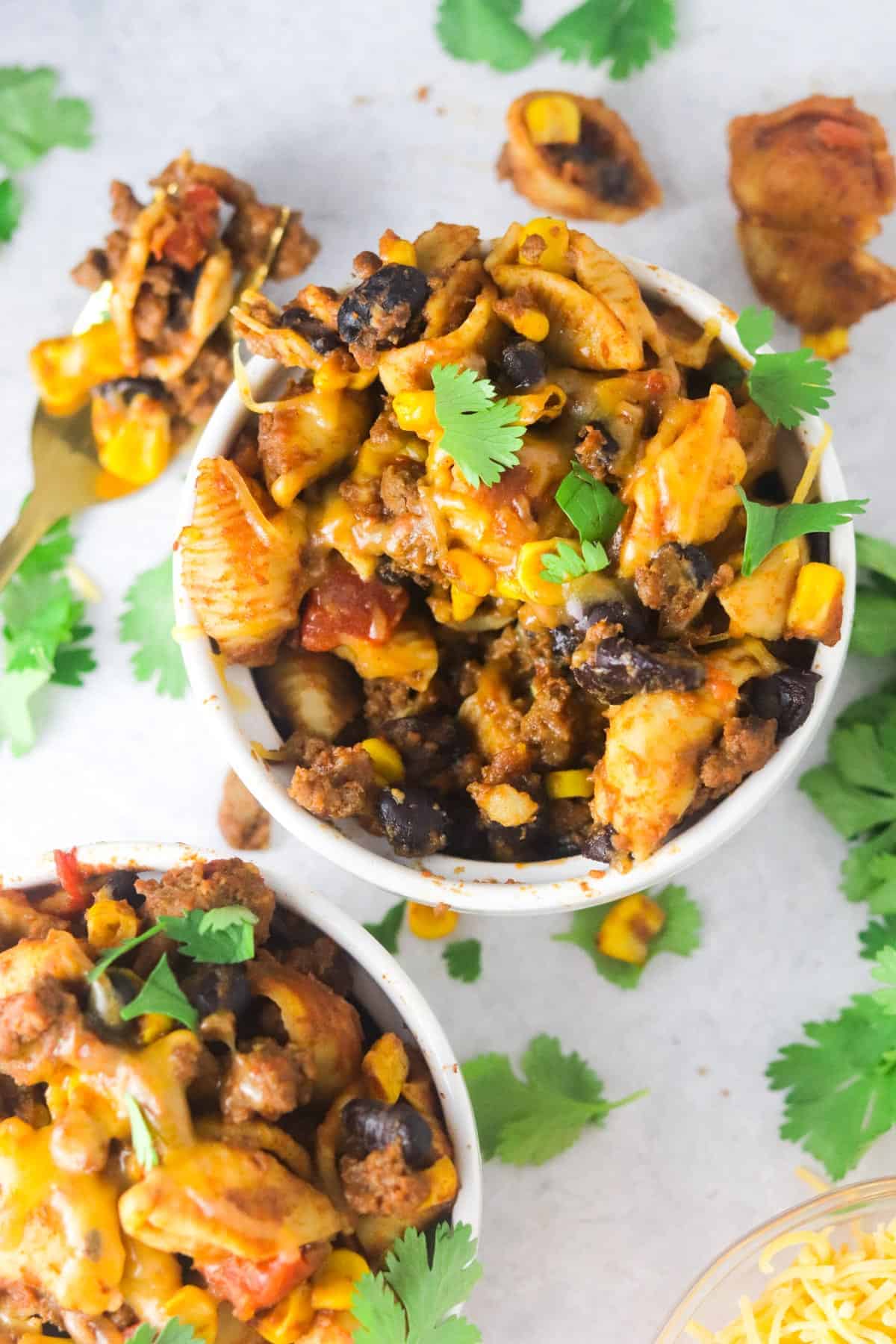 Instant pot taco pasta in a white bowl with cilantro.