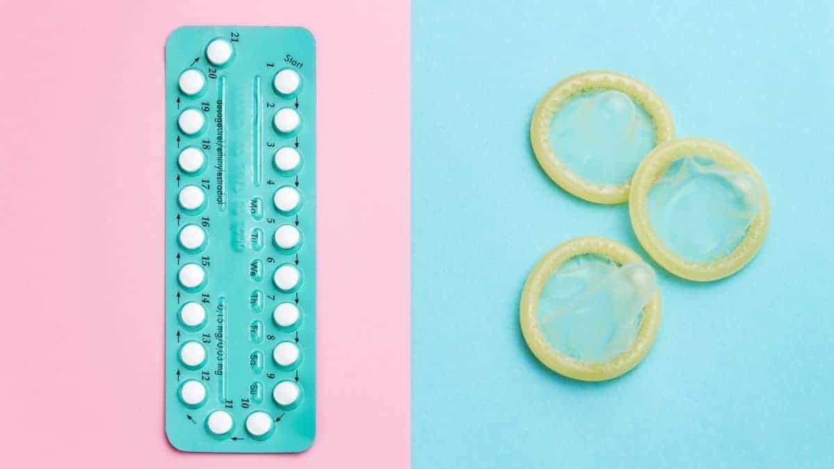 birth control pill and condoms on pink and blue backgrounds.