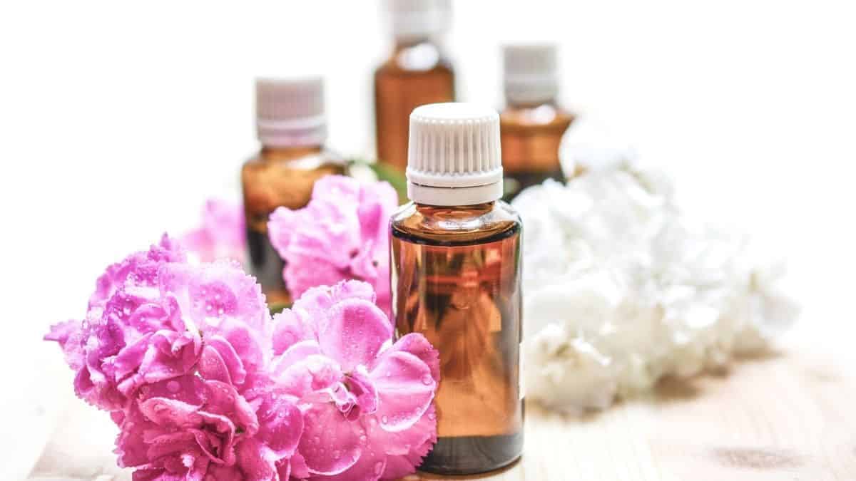 Flours and glass jars of essential oils on the counter.