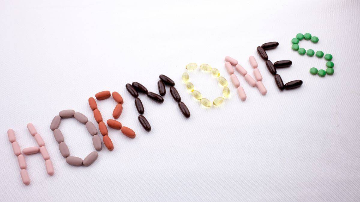 hormones spelled out with pills.