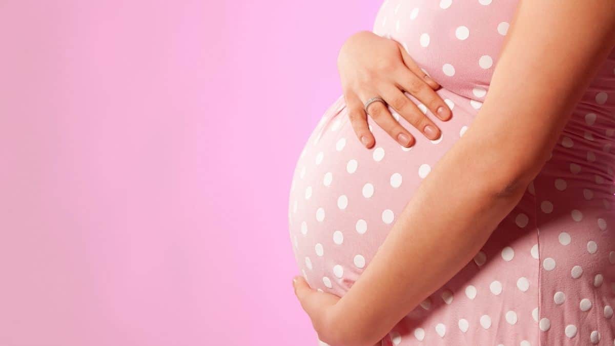 pink polka dot dress pregnant woman.