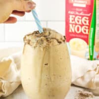 straw into eggnog smoothie.