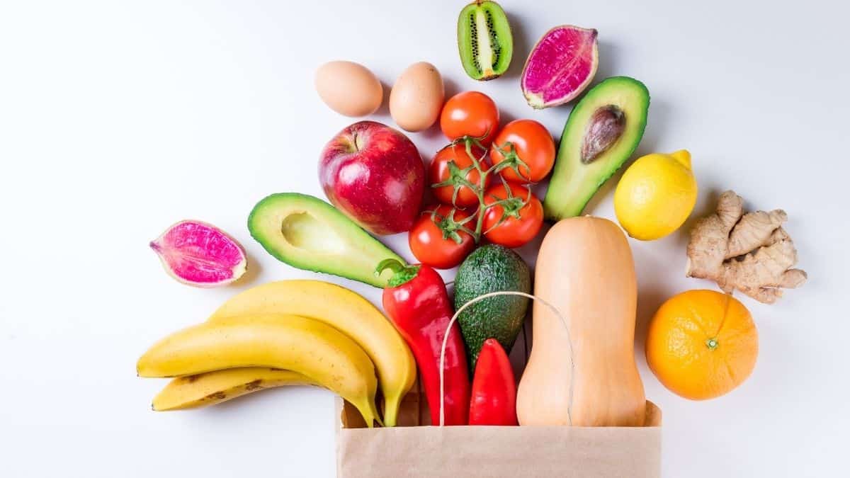 Variety of nourishing foods in a grocery bag.