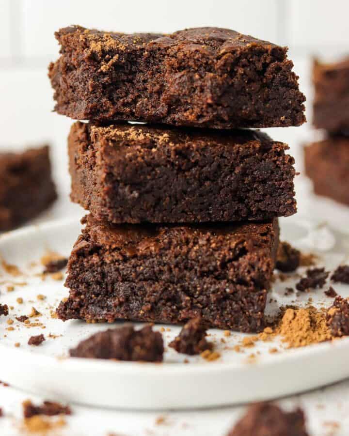 air fryer brownies stacked on a plate.