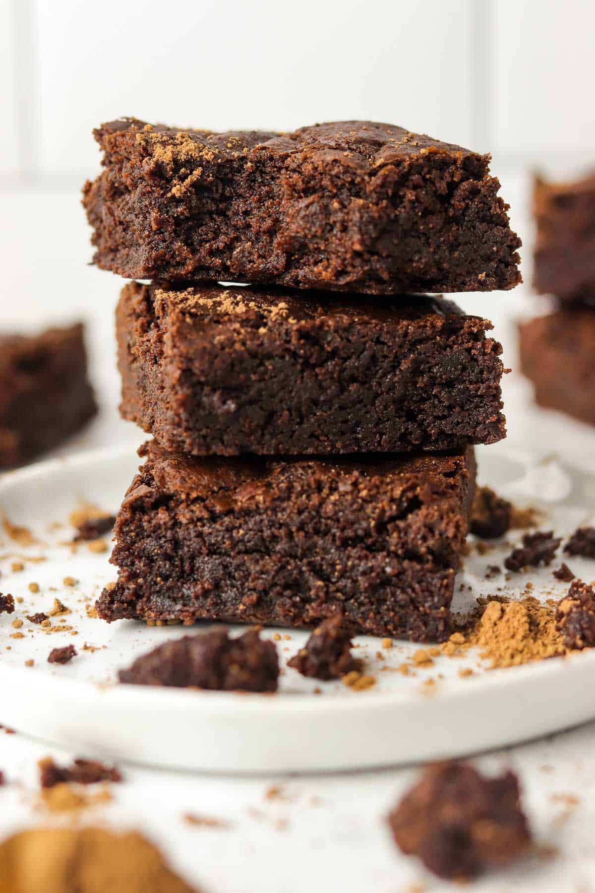 air fryer brownies stacked on a plate.