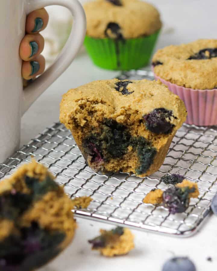 gluten free blueberry muffin on a cooling rack.