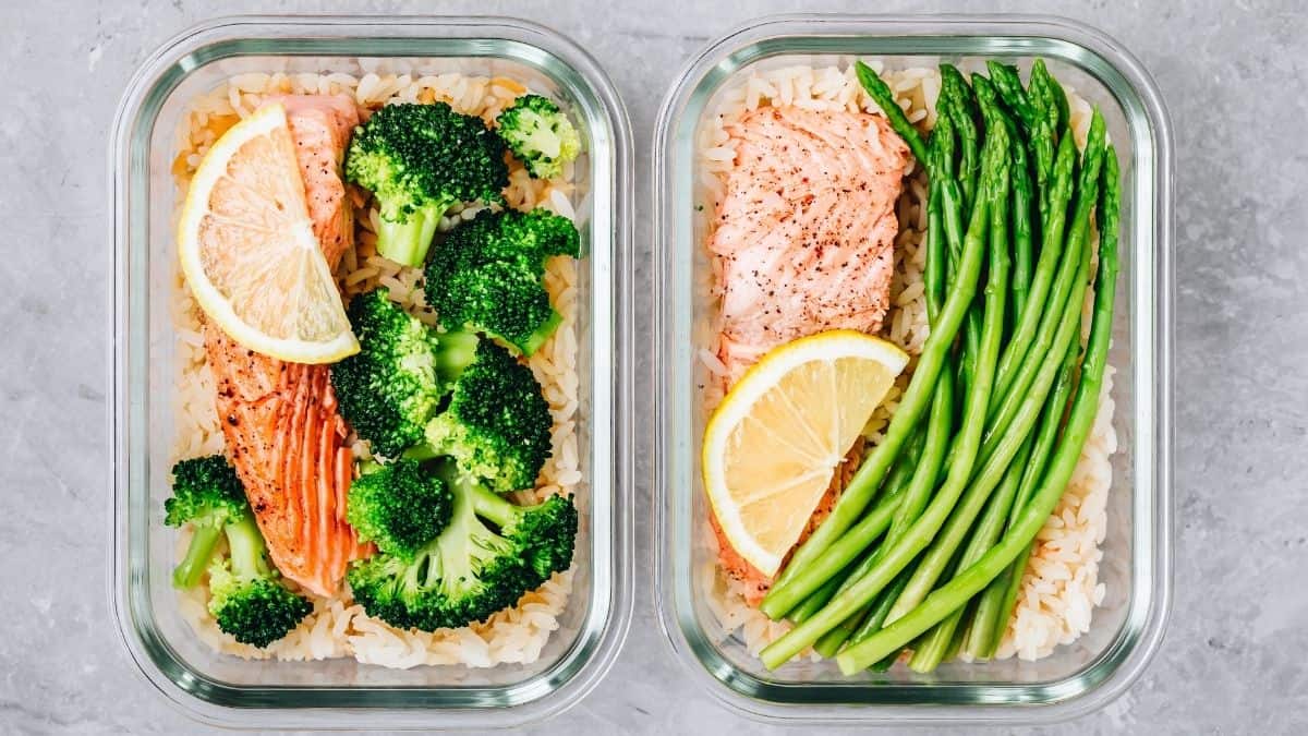 two containers of meal prepped salmon, rice and veggies