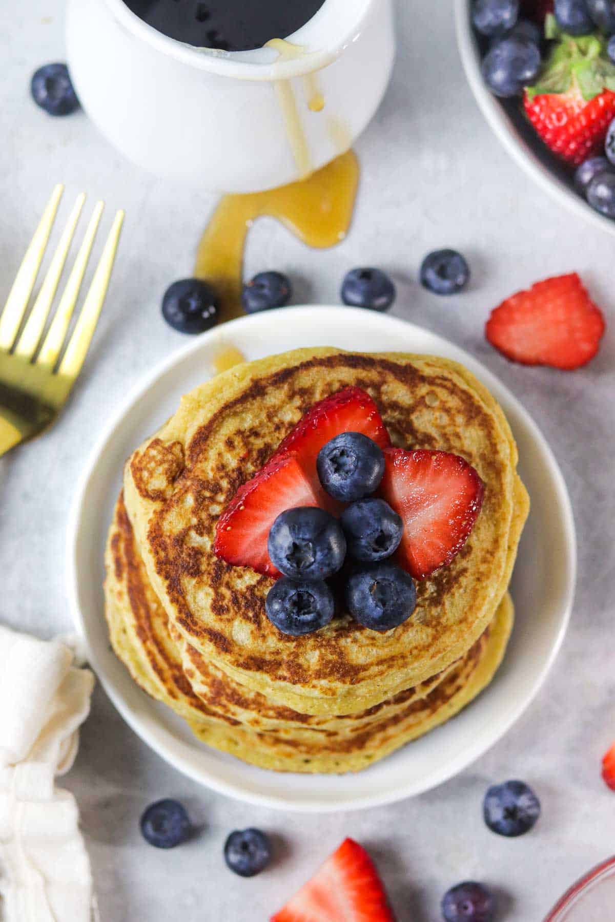 stack of protein pancakes without protein powder with berries.