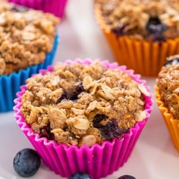 blueberry banana oat muffin in a pink liner.