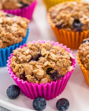 blueberry banana oat muffin in a pink liner.