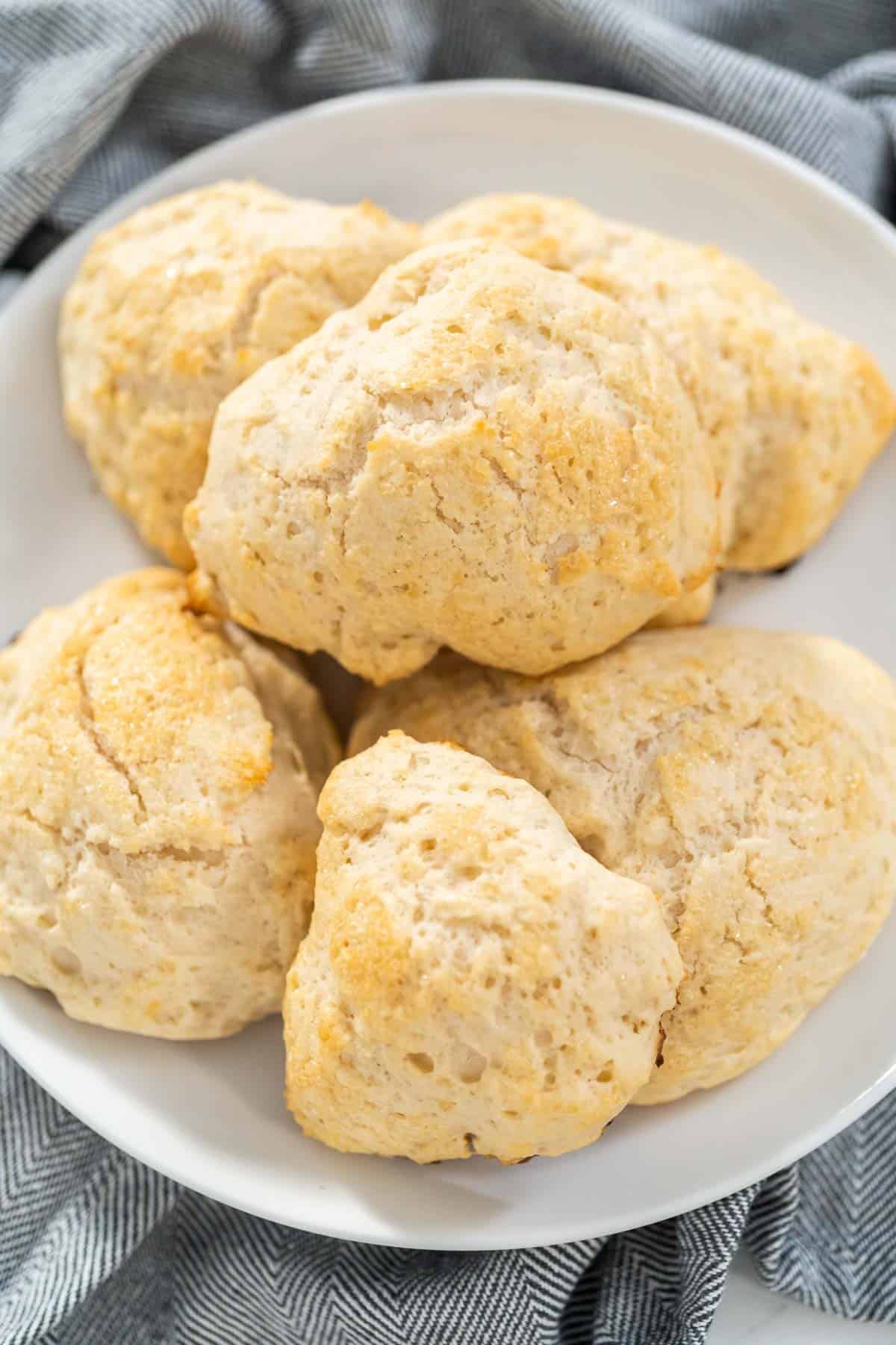 Up close 3 ingredient scones on a white plate.