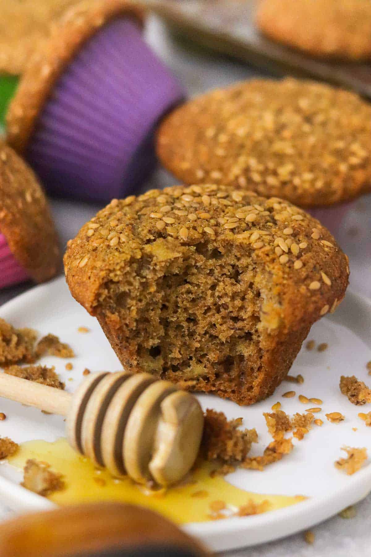 honey flaxseed muffin with a bite out of it.