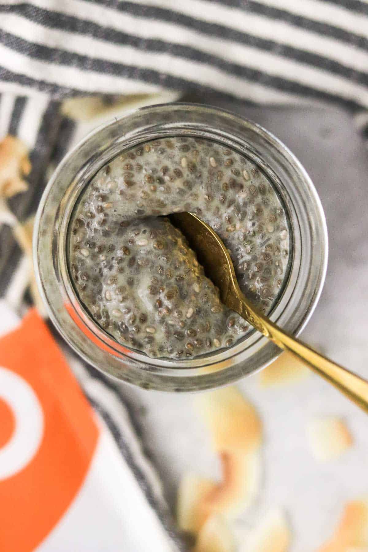 scooping protein chia pudding with a spoon