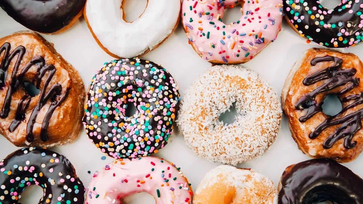 a variety of colorful donuts, an example of food prohibited on the slow carb diet.