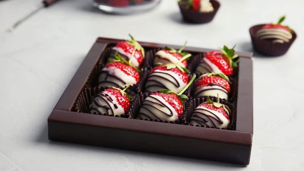 chocolate covered strawberries in a brown box.