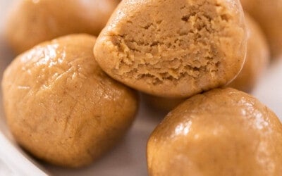 A close up of a plate of peanut butter balls to show texture.