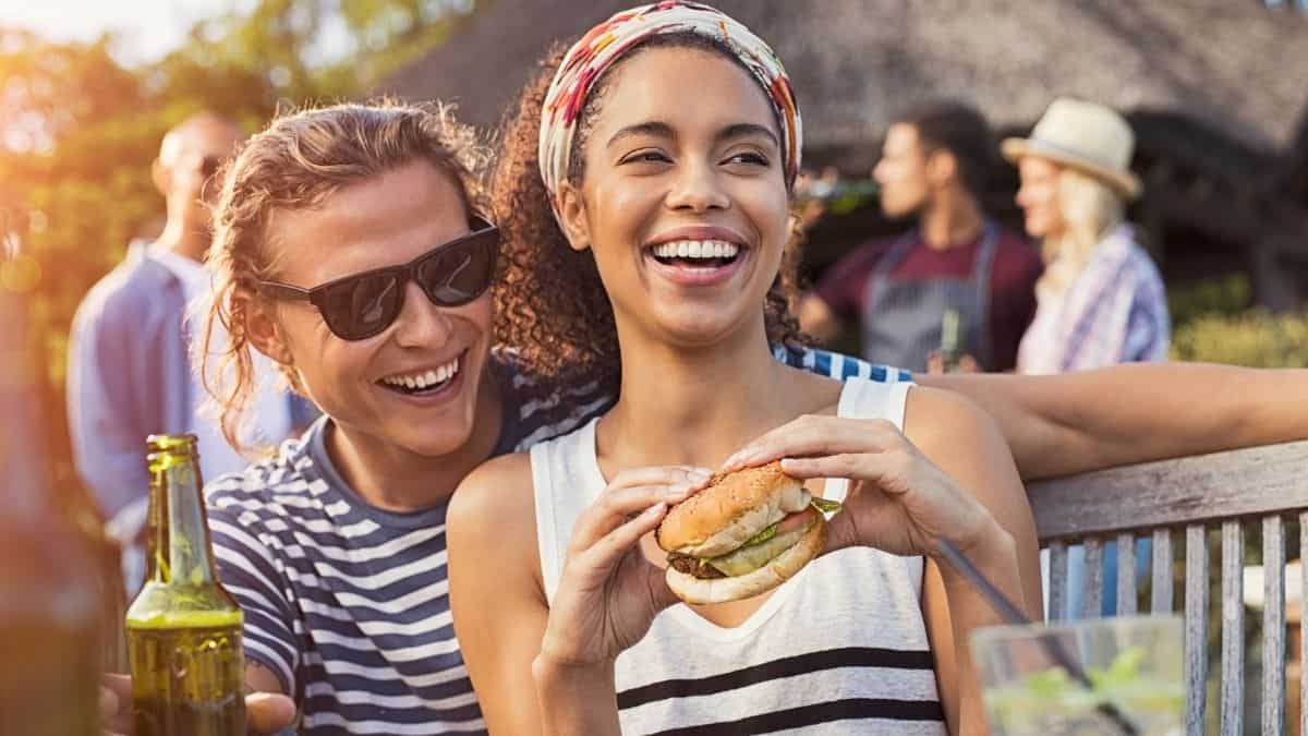 a man and woman having fun and enjoying a fun dinner out.