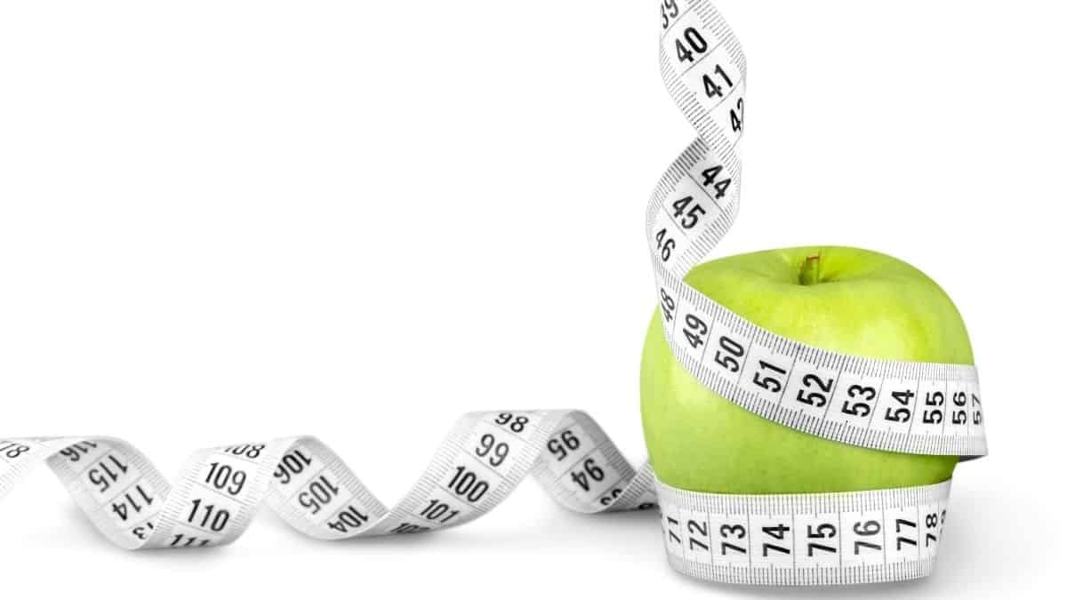 https://colleenchristensennutrition.com/wp-content/uploads/2021/11/An-apple-with-a-measuring-tape-wound-around-it-maybe-someone-is-tracking-the-calories-through-noom-or-myfitnesspal..jpg