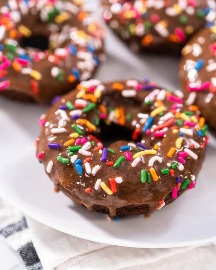A plate of protein donuts with sprinkles