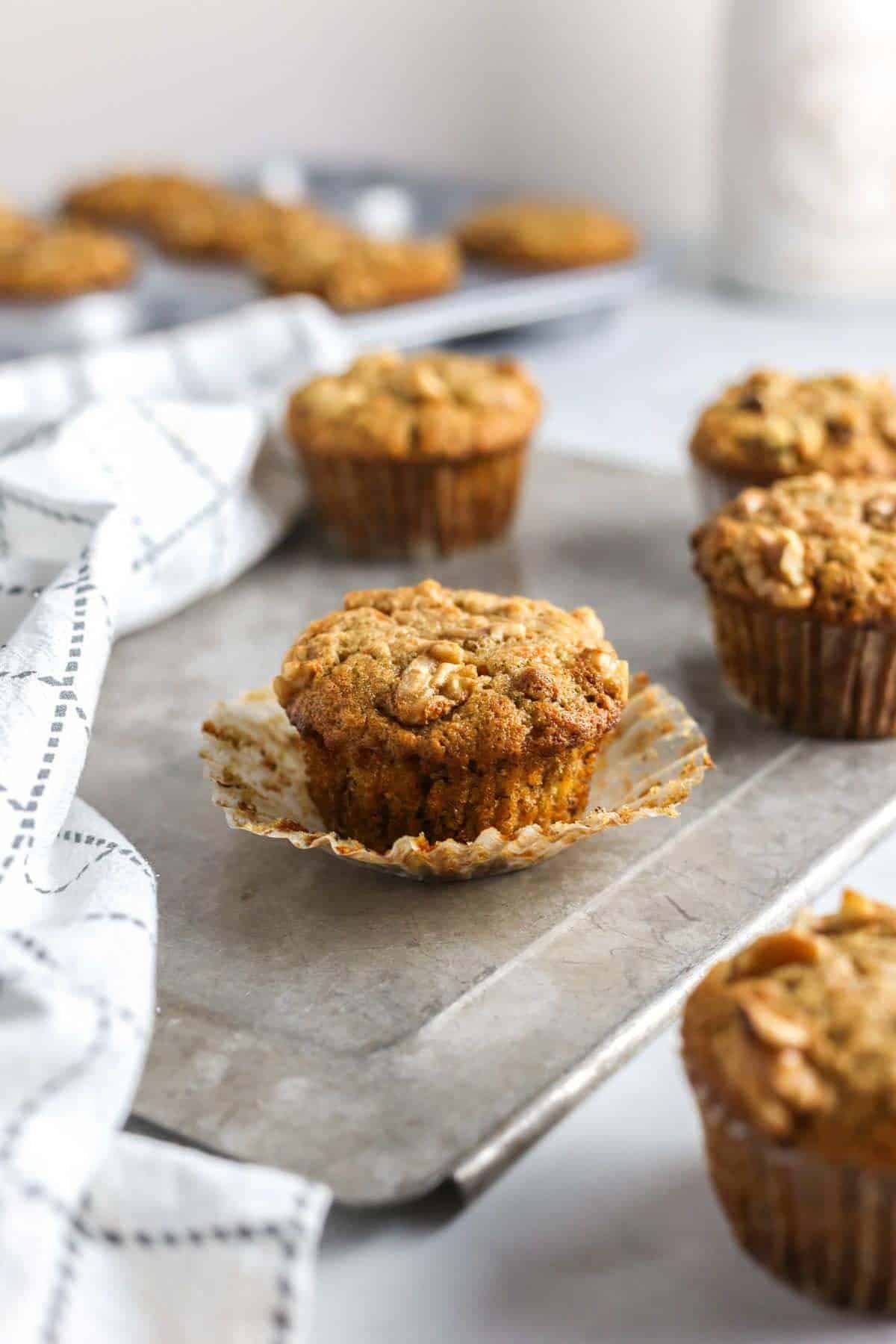 Banana carrot muffins cooling on a counter