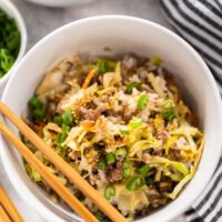 A bowl of Inside Out Egg Roll, served with chopsticks.